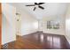 Bright living room with hardwood floors, vaulted ceiling, and natural light through a large window at 12527 Saksons Blvd, Fishers, IN 46038