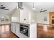 Open-concept living area with vaulted ceilings and a modern kitchen at 12527 Saksons Blvd, Fishers, IN 46038