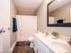 Bathroom featuring double sinks, a large framed mirror, and a shower with curtain at 12566 S Hillview Dr, Columbus, IN 47201