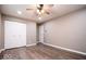 Empty bedroom showcasing a closet, neutral walls, wood-look flooring, and a ceiling fan at 12566 S Hillview Dr, Columbus, IN 47201