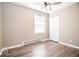 This is a bedroom with a ceiling fan, a window and a closet at 12566 S Hillview Dr, Columbus, IN 47201