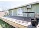 Wooden deck with outdoor furniture and sliding glass door at 12566 S Hillview Dr, Columbus, IN 47201