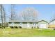 Charming single story home featuring an attached garage and a well-maintained front lawn at 12566 S Hillview Dr, Columbus, IN 47201