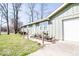 Angle view of home showing landscaping, driveway, and attached single car garage at 12566 S Hillview Dr, Columbus, IN 47201