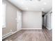 Living room featuring light gray walls, hardwood floors, and white trim and window at 12566 S Hillview Dr, Columbus, IN 47201