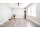 Open living room featuring modern flooring, neutral walls, and natural light at 12566 S Hillview Dr, Columbus, IN 47201