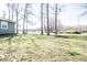 A large yard with mature trees and green grass at 12566 S Hillview Dr, Columbus, IN 47201