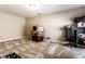 Unfinished basement space with neutral carpet, suitable for storage or customization at 1371 Blackthorne N Trl, Plainfield, IN 46168