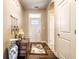 Welcoming entryway featuring a decorative rug, stylish lighting, and neutral walls, creating a warm and inviting atmosphere at 1371 Blackthorne N Trl, Plainfield, IN 46168