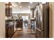 Spacious kitchen with stainless steel appliances, granite countertops, and dark wood cabinets at 1371 Blackthorne N Trl, Plainfield, IN 46168