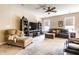 Comfortable living room with neutral tones, a ceiling fan, and plush seating, perfect for relaxation and Gathering gatherings at 1371 Blackthorne N Trl, Plainfield, IN 46168