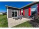 Cozy patio with gray wicker furniture, sliding door, and views of the lawn at 1371 Blackthorne N Trl, Plainfield, IN 46168