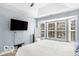 Bright bedroom with bay window and mounted television at 13982 Avalon Blvd, Fishers, IN 46037