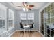 Bright dining area/home office with natural light, a ceiling fan, and sliding glass door to patio at 13982 Avalon Blvd, Fishers, IN 46037