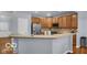 Well-lit kitchen features wooden cabinets, stainless steel appliances, and tiled backsplash at 13982 Avalon Blvd, Fishers, IN 46037
