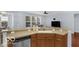 Bright kitchen includes breakfast bar seating overlooking adjacent living area at 13982 Avalon Blvd, Fishers, IN 46037