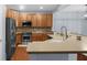 Modern kitchen featuring stainless steel appliances, tile backsplash, and ample counter space at 13982 Avalon Blvd, Fishers, IN 46037
