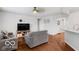 Open-concept living room features wood floors and natural light at 13982 Avalon Blvd, Fishers, IN 46037