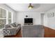 Open-concept living room features wood floors and natural light at 13982 Avalon Blvd, Fishers, IN 46037