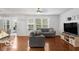 Open-concept living room features wood floors and natural light at 13982 Avalon Blvd, Fishers, IN 46037