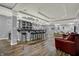 Basement bar with modern lighting, hardwood floors and seating for hosting guests and entertaining at 14019 Colville Cir, Carmel, IN 46033