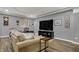 Finished basement featuring comfortable seating, a large screen TV and hardwood floors at 14019 Colville Cir, Carmel, IN 46033
