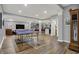 Finished basement featuring a ping pong table, bar area, and hardwood floors providing endless entertainment options at 14019 Colville Cir, Carmel, IN 46033
