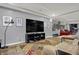 Finished basement with large screen TV, comfortable seating, and a stylish wine storage providing an inviting space at 14019 Colville Cir, Carmel, IN 46033