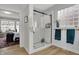 Modern bathroom featuring a glass-enclosed shower and decorative glass block window for privacy and natural light at 14019 Colville Cir, Carmel, IN 46033