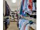 Walk-in closet featuring extensive storage with hanging rods and shelving to maximize organization at 14019 Colville Cir, Carmel, IN 46033