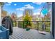 Enjoy outdoor living on this deck with black railings, potted plants, and a unique metal sculpture against a blue sky at 14019 Colville Cir, Carmel, IN 46033