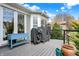 Spacious deck perfect for entertaining, equipped with grills, a blue planter, and a scenic backyard view at 14019 Colville Cir, Carmel, IN 46033