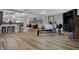 Basement exercise equipment including rower and free weights with bar and seating in background at 14019 Colville Cir, Carmel, IN 46033