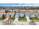 Charming home featuring a well-kept lawn and a gray exterior with a contrasting yellow front door at 14019 Colville Cir, Carmel, IN 46033