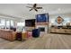 Inviting living room featuring a stone fireplace and hardwood floors at 14019 Colville Cir, Carmel, IN 46033