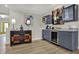 Stylish wet bar area features a mini fridge and eye-catching artwork at 14019 Colville Cir, Carmel, IN 46033