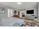Bright main bedroom with wood floors, a view into a walk-in closet, and comfortable furnishings for a serene atmosphere at 14019 Colville Cir, Carmel, IN 46033