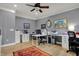 Bright home office featuring multiple desks and storage with hardwood floors and light gray walls at 14019 Colville Cir, Carmel, IN 46033