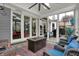 Bright sunroom featuring a modern ceiling fan, comfortable seating, and large windows offering scenic outdoor views at 14019 Colville Cir, Carmel, IN 46033