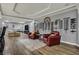Basement wine cellar features wine storage, space for exercise equipment, and comfortable seating at 14019 Colville Cir, Carmel, IN 46033