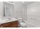 Clean bathroom features white tub, neutral walls, wooden vanity and a modern sink at 14317 Banister Dr, Noblesville, IN 46060