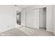 Bright bedroom featuring neutral carpet, closet, and an open doorway to another room at 14317 Banister Dr, Noblesville, IN 46060