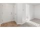 Bright foyer featuring neutral paint, ceramic tile, and plush carpet at 14317 Banister Dr, Noblesville, IN 46060