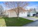 Attached two-car garage with a white door and concrete driveway, with a blue sky backdrop at 14317 Banister Dr, Noblesville, IN 46060