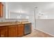 Kitchen area showing granite countertops, stainless steel appliances, and open to living area at 14317 Banister Dr, Noblesville, IN 46060