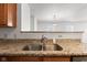 Close-up of the kitchen sink featuring granite countertops at 14317 Banister Dr, Noblesville, IN 46060