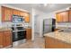 Updated kitchen with stainless steel appliances and granite countertops at 14317 Banister Dr, Noblesville, IN 46060