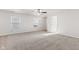 Bright, airy living room with plush carpet and lots of natural light at 14317 Banister Dr, Noblesville, IN 46060
