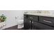 Half bath with a dark vanity, granite countertop, decorative fixtures, and elegant design at 1444 Waterleaf Dr, Westfield, IN 46074