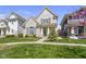 Beautifully landscaped front yard with mature trees and well-maintained lawn at 1444 Waterleaf Dr, Westfield, IN 46074